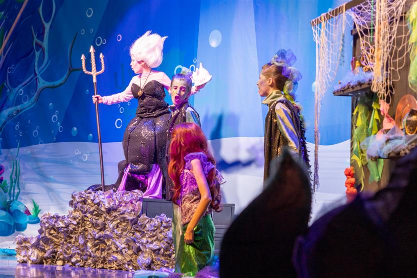 Students perform onstage
